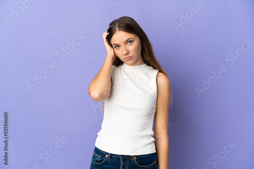 Young Lithuanian woman isolated on purple background with an expression of frustration and not understanding