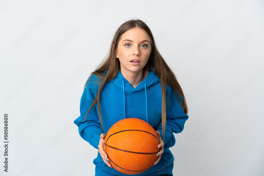 Young Lithuanian woman isolated on white background playing basketball