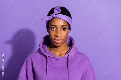 Fototapeta Photo of calm focused transgender look camera wear headband sweatshirt isolated