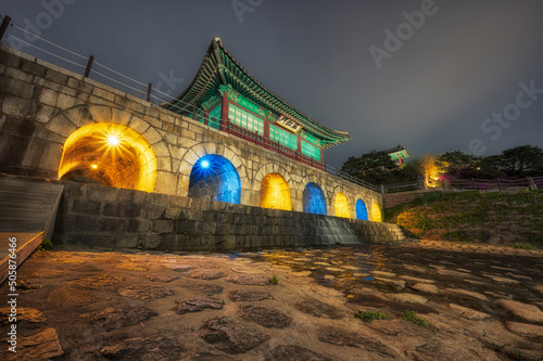 Spring and night view of Suwon Hwaseong Fortress in Suwon City, Gyeonggi-do, Korea. Suwon Hwaseong Fortress is a UNESCO World Heritage Site. photo