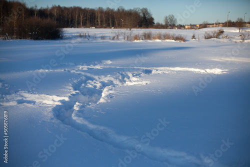 Path in snow. Snowy field. Winter in Russia. Snow cover.