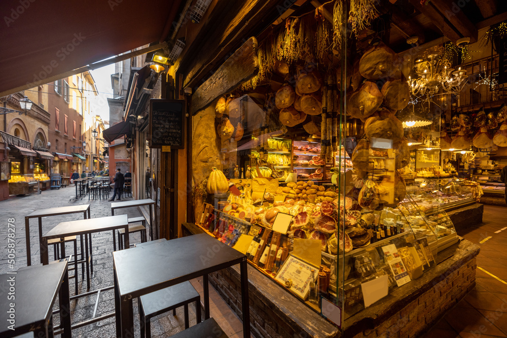 Famous gastronomical street with food stores and restaurants in Bologna city. Italian food and gastronomy concept