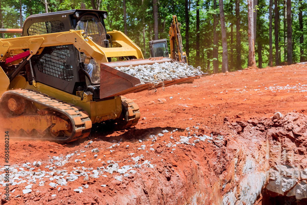 Industrial construction site residential areas a small tractor of gravel moving