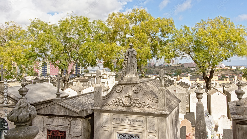 Φωτογραφία Old grave chapels of Alto de Sao Joao cemetery with apartment buildings of the c