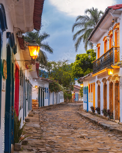 Fototapeta Naklejka Na Ścianę i Meble -  View to the streets of the colonial city of paraty at the sunrise with the street light on in Rio de Janeiro - Brasil