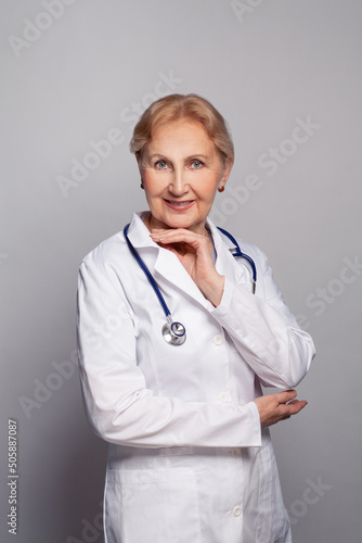 Woman doctor standing with stetoscope over her neck and smiling