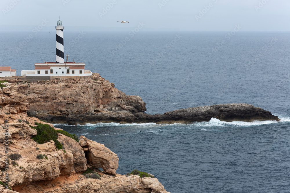 Cala Figuera lighthouse located in the municipality of Calviá, in a coastal area through which the boats that go to the city of Palma pass. Mallorca, Spain.