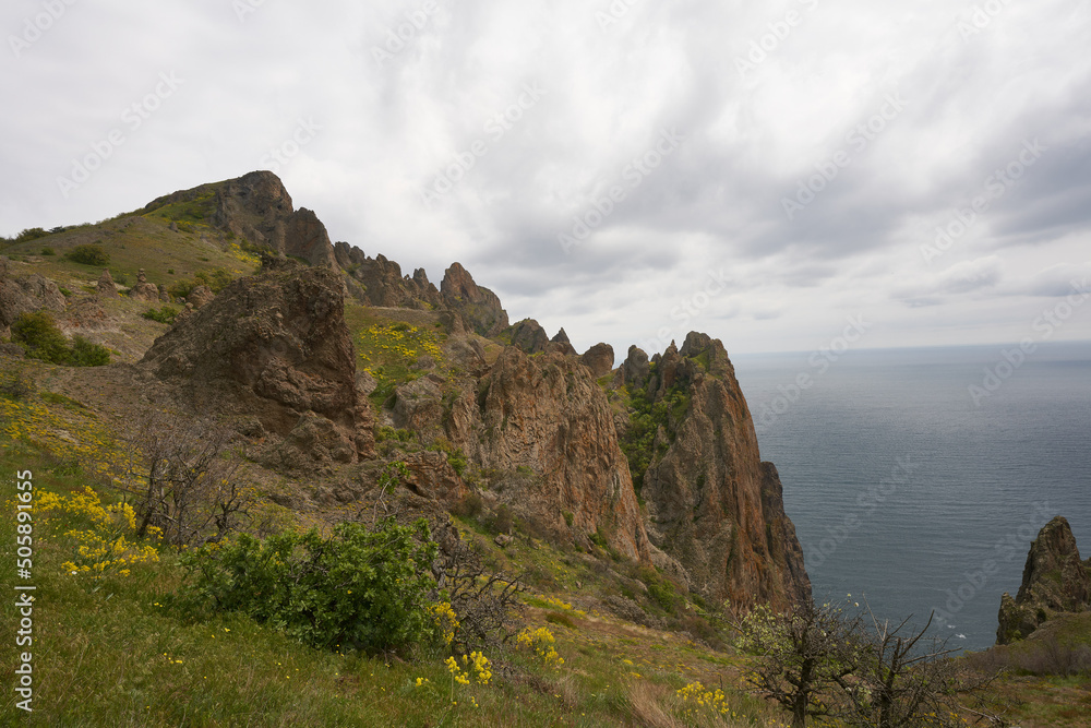 mountains sea against the background of a cloudy sky mountains sea against the background of a cloudy sky