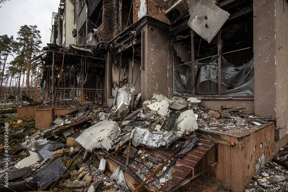 Fototapeta premium Irpin, Kyev region Ukraine - 09.04.2022: Cities of Ukraine after the Russian occupation. Destroyed buildings on the streets of Irpen. Broken, shelled windows. Buildings after being hit by missiles.