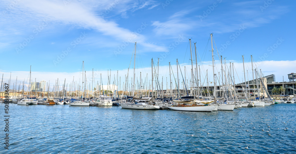 Beautiful ships and yachts in marina Rambla de Mar in Port Vell, Barcelona, Spain