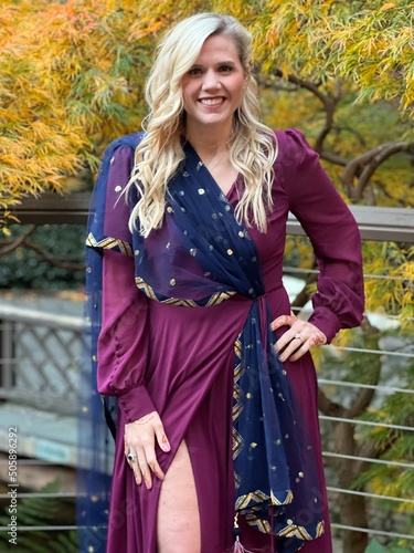A Caucasian woman dressed in traditional Indian attire