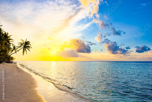 Beautiful evening sunset on the coast of the island. Maldives.