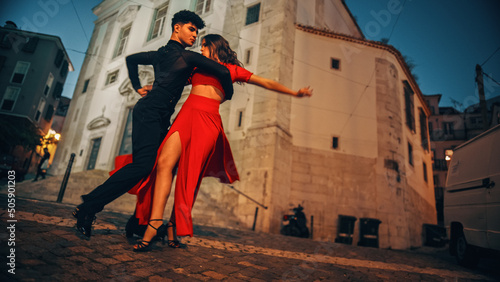 Beautiful Couple Dancing a Latin Dance on the Quiet Street of an Old Town in a City. Sensual Dance by Two Professional Dancers in the Evening in Ancient Culturally Rich Tourist Location.