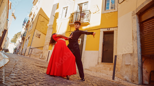 Beautiful Couple Dancing a Latin Dance on the Quiet Street of an Old Town in a City. Sensual Dance by Two Professional Dancers on a Sunny Day Outside in Ancient Culturally Rich Tourist Location.