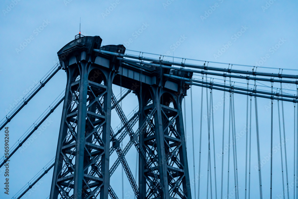 The Williamsburg Bridge and the East River at twilight. The Williamsburg Bridge and the East River at twilight.