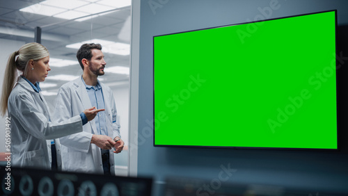 Medical Neuroscience Hospital Lab Meeting: Neurosurgeon and Neurologist Use Green Screen Chroma Key TV, Talk About Sick Patient Treatment Method, Advanced Drugs, High-Tech Biotechnology Research