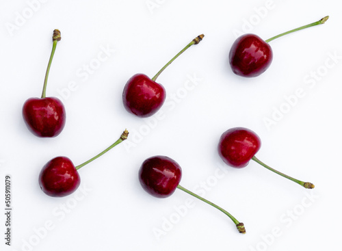 Berries of juicy ripe red cherries isolated on white background.