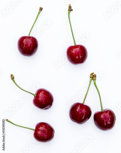 Berries of juicy ripe red cherries isolated on white background.