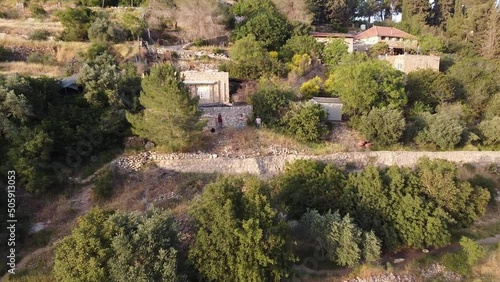 3 people standing on a mountain in Ein Karem in Jerusalem. photo