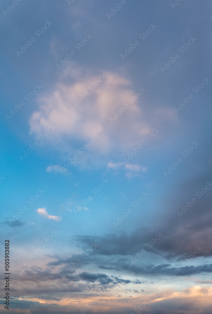 Fantastic clouds at sunrise, vertical panorama