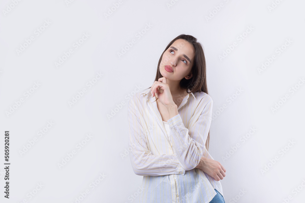 Portrait of a beautiful young woman thinking, isolated on white background Portrait of a beautiful young woman thinking, isolated on white background