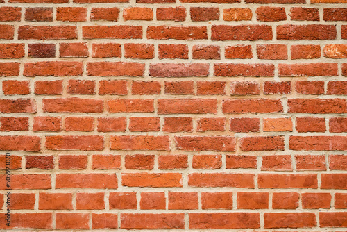 Red brick wall, natural brick texture. Grunge background