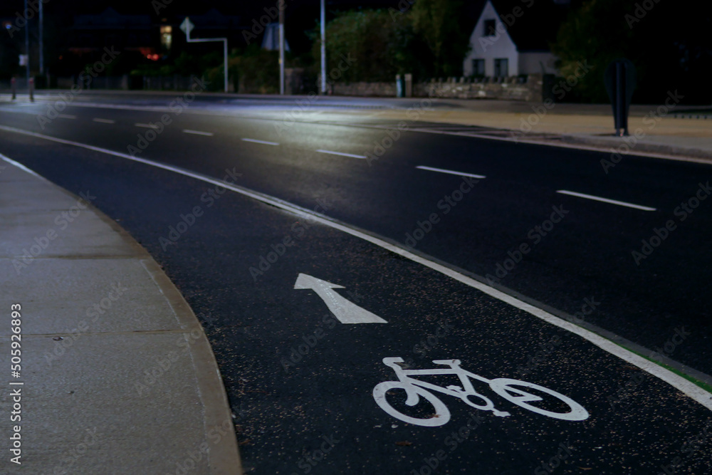 Cycling line and empty road at night. Cycling line and empty road at night.
