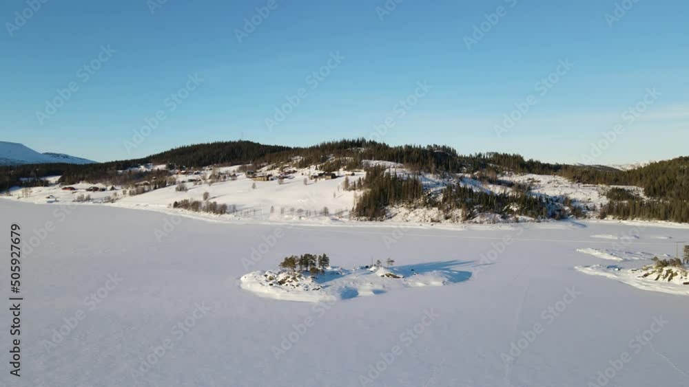 Aerial top view from drone of frozen lake, snow and forest in Rauland - Norway Aerial top view from drone of frozen lake, snow and forest in Rauland - Norway