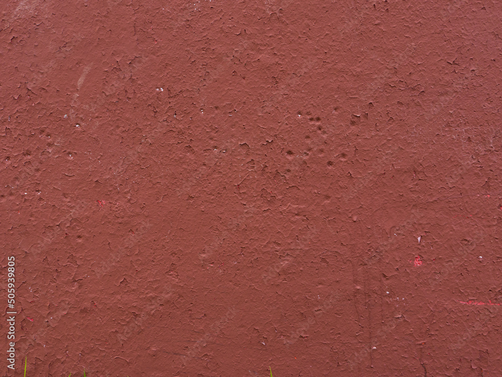 Fototapeta premium Peeling brown plaster on the wall.