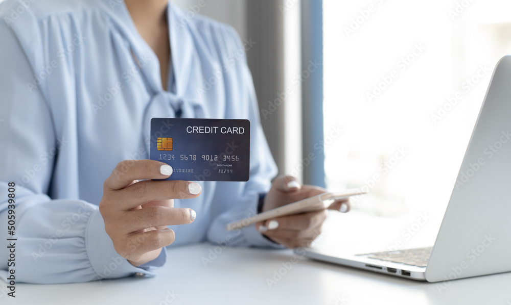 Women use smart phone to register online purchases using credit card payments, Convenience in the world of technology and the internet, Shopping online and banking online concept. Women use smart phone to register online purchases using credit card payments, Convenience in the world of technology and the internet, Shopping online and banking online concept.