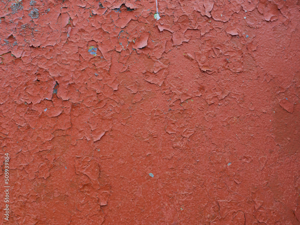 Old wall covered with red paint.