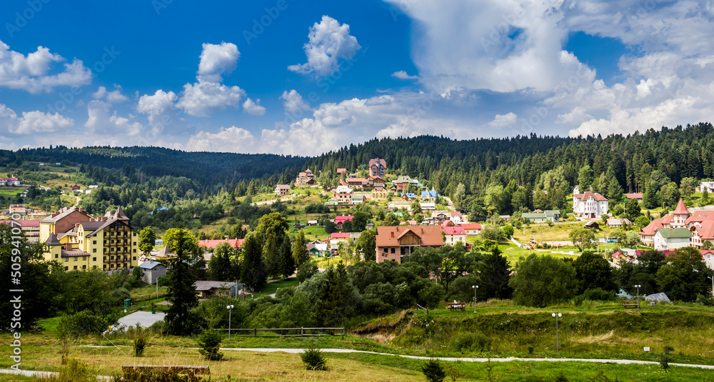 many big cottages in the valley in the Ukrainian Carpathians