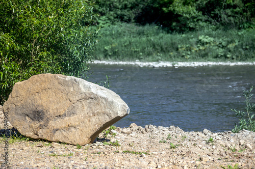 a big stone on rivebank photo