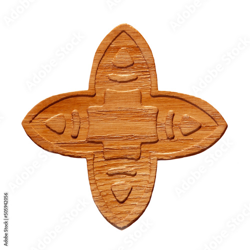 Wooden amulet with ancient ornament isolated on white background