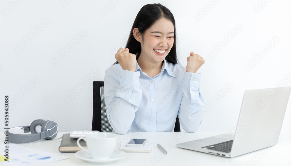 Asian women are successful and happy to be able to meet their targets, Excited, Delighted with beautiful achievements.