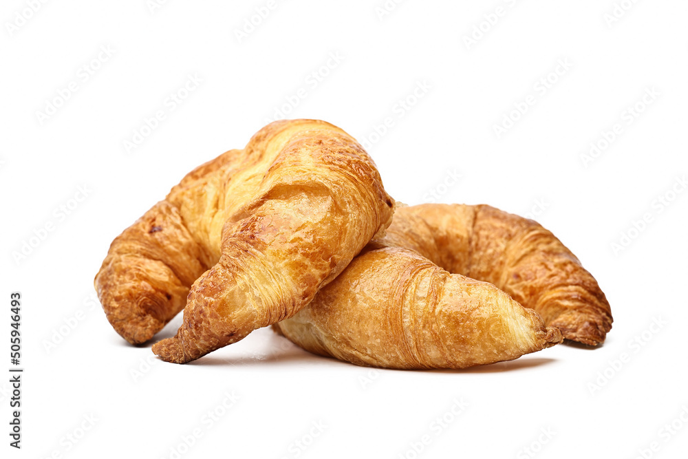 Two fresh croissants on a white background.