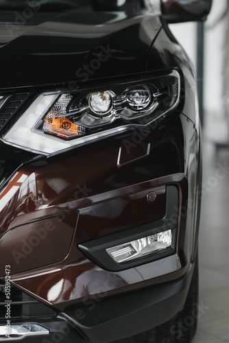headlight of modern prestigious car close up. © Serhii