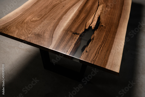 large table cover made of natural walnut wood and transparent epoxy