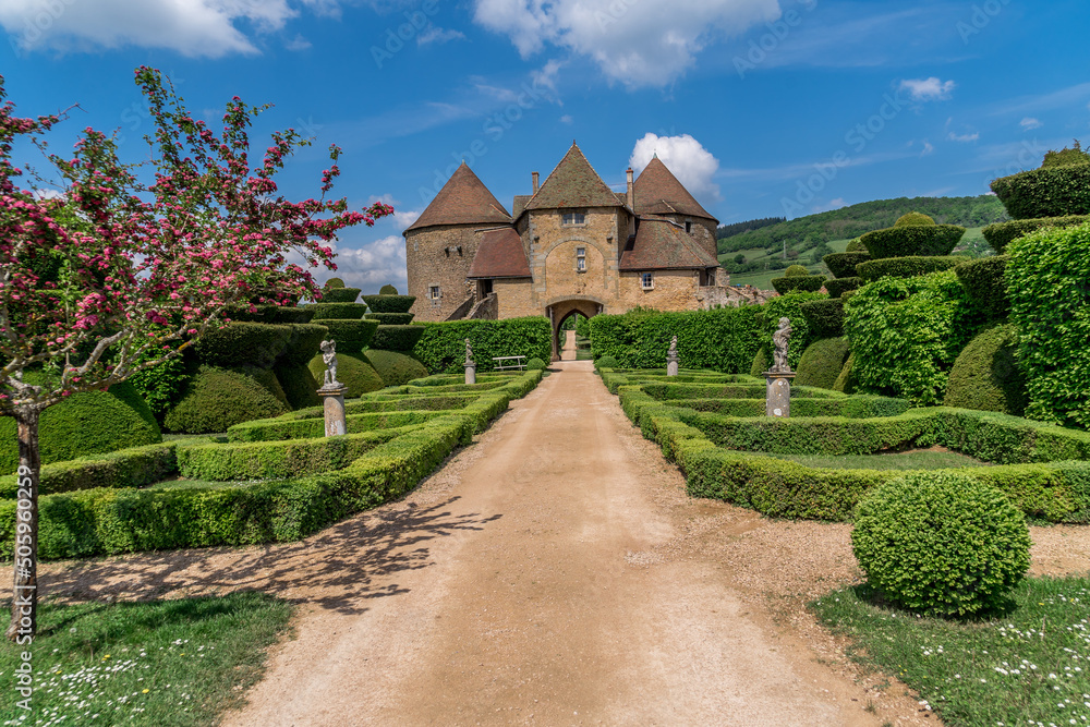 French garden in the imposing castle of Berze Le Chatel in Burgundy with 14 towers and three enclosures in Central France