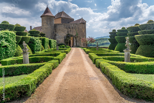 French garden in the imposing castle of Berze Le Chatel in Burgundy with 14 towers and three enclosures in Central France photo