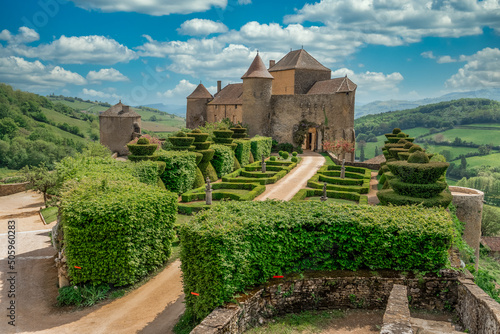 French garden in the imposing castle of Berze Le Chatel in Burgundy with 14 towers and three enclosures in Central France photo
