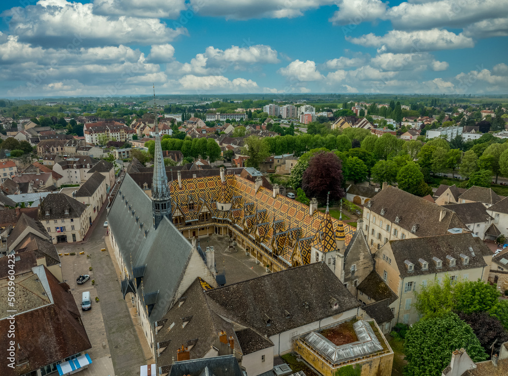 Aerial view of  beautiful varnished tile beautiful varnished tile polychrome roofs of the Hotel de Dieu medieval Gothic hospice in Beaune, Burgundy France