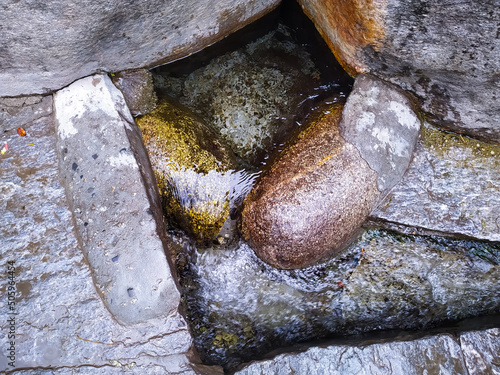 Pure water coming out of stones in NeharuKund, Manali, Himachal Pradesh, India