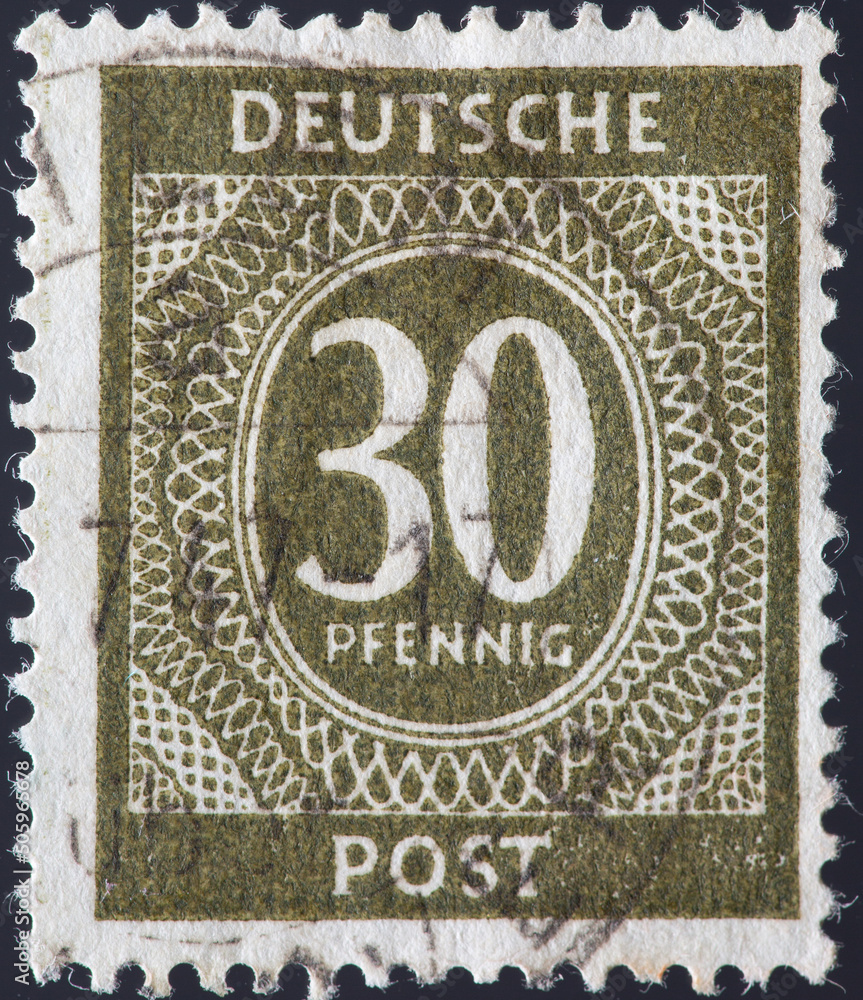 GERMANY - CIRCA 1946: a postage stamp from GERMANY, showing a permanent stamp numerals in oval with ornaments. Text: Deutsche Post. Circa 1946