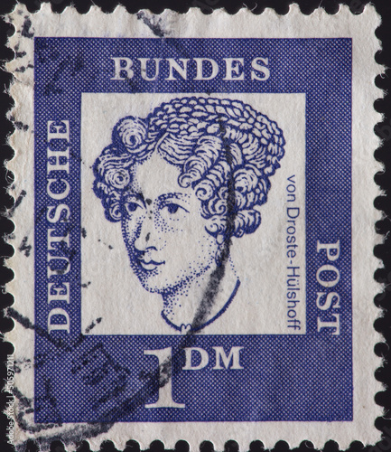 GERMANY - CIRCA 1961: a postage stamp from GERMANY, showing a portrait of the German writer and composer Annette von Droste-Hülshoff from Havixbeck. Circa 1961 photo