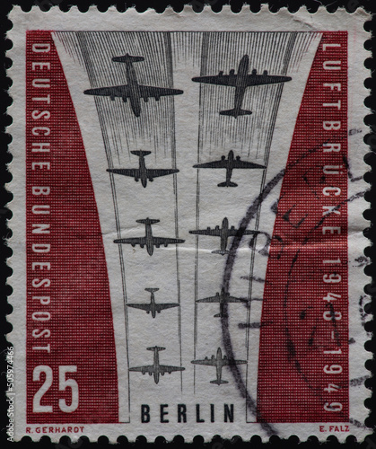 GERMANY-BERLIN - CIRCA 1959: a postage stamp from GERMANY-BERLIN, showing airplanes stylizing the symbol of the airlift.10. anniversary of the end of the blockade of Berlin. Circa 1959