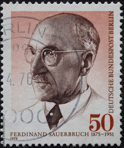 GERMANY-BERLIN - CIRCA 1975: a postage stamp from GERMANY-BERLIN, showing a portrait of Generalarzt, State Councilor, Privy Councilor, University Professor and Surgeon Ferdinand Sauerbruch. Circa 1975 photo