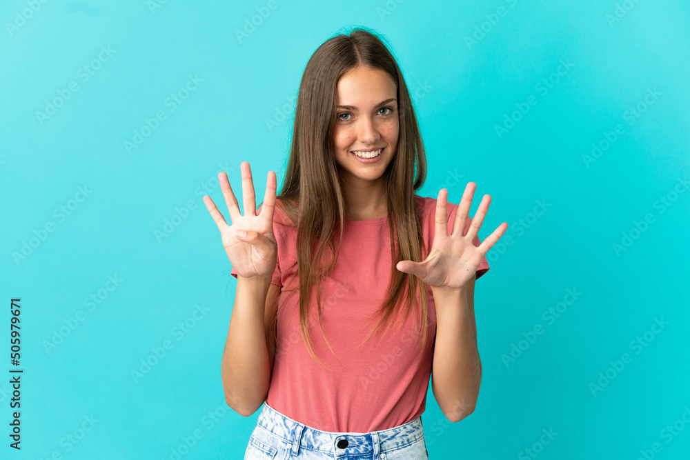 Young woman over isolated blue background counting nine with fingers Young woman over isolated blue background counting nine with fingers