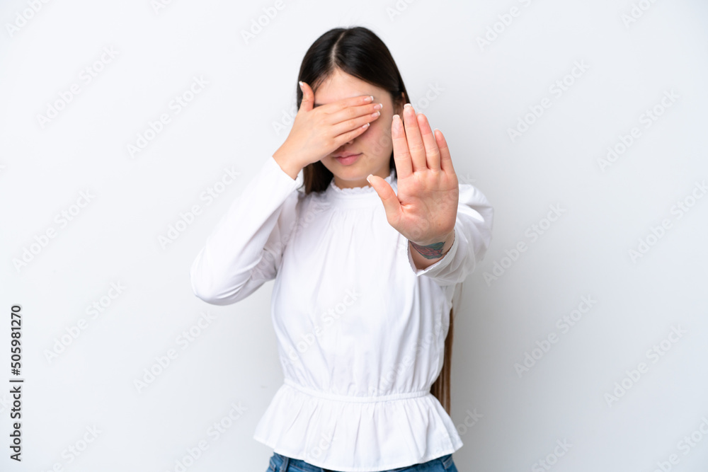 Young Chinese woman isolated on white background making stop gesture and covering face Young Chinese woman isolated on white background making stop gesture and covering face