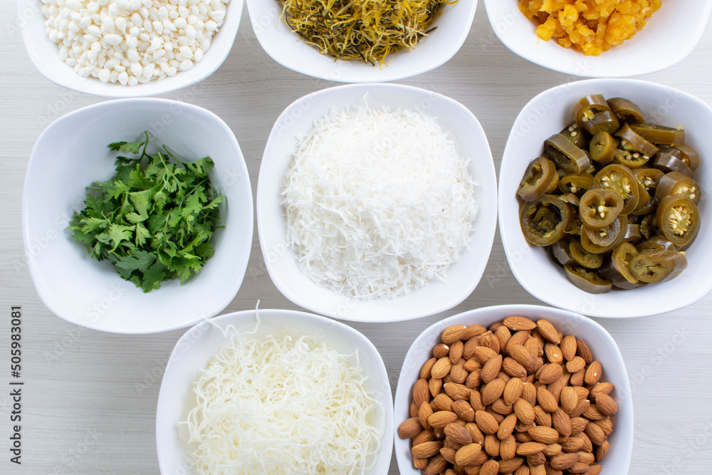 Variety of topping, ingredients to accompany sushi, displayed in white container Variety of topping, ingredients to accompany sushi, displayed in white container
